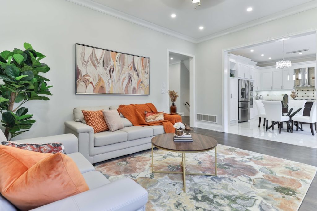 a-living-room-filled-with-furniture-and-a-painting-on-the-wall-skrgmibmhza